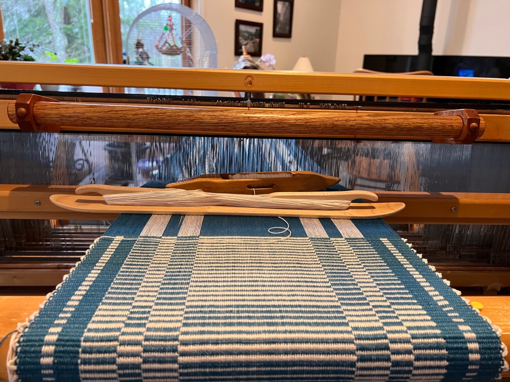 This image has an empty alt attribute; its file name is blue-placemats-on-loom.jpg